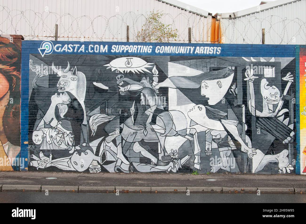 Political mural based on Picasso's Guernica on the Falls Road Belfast Northern Ireland Stock Photo