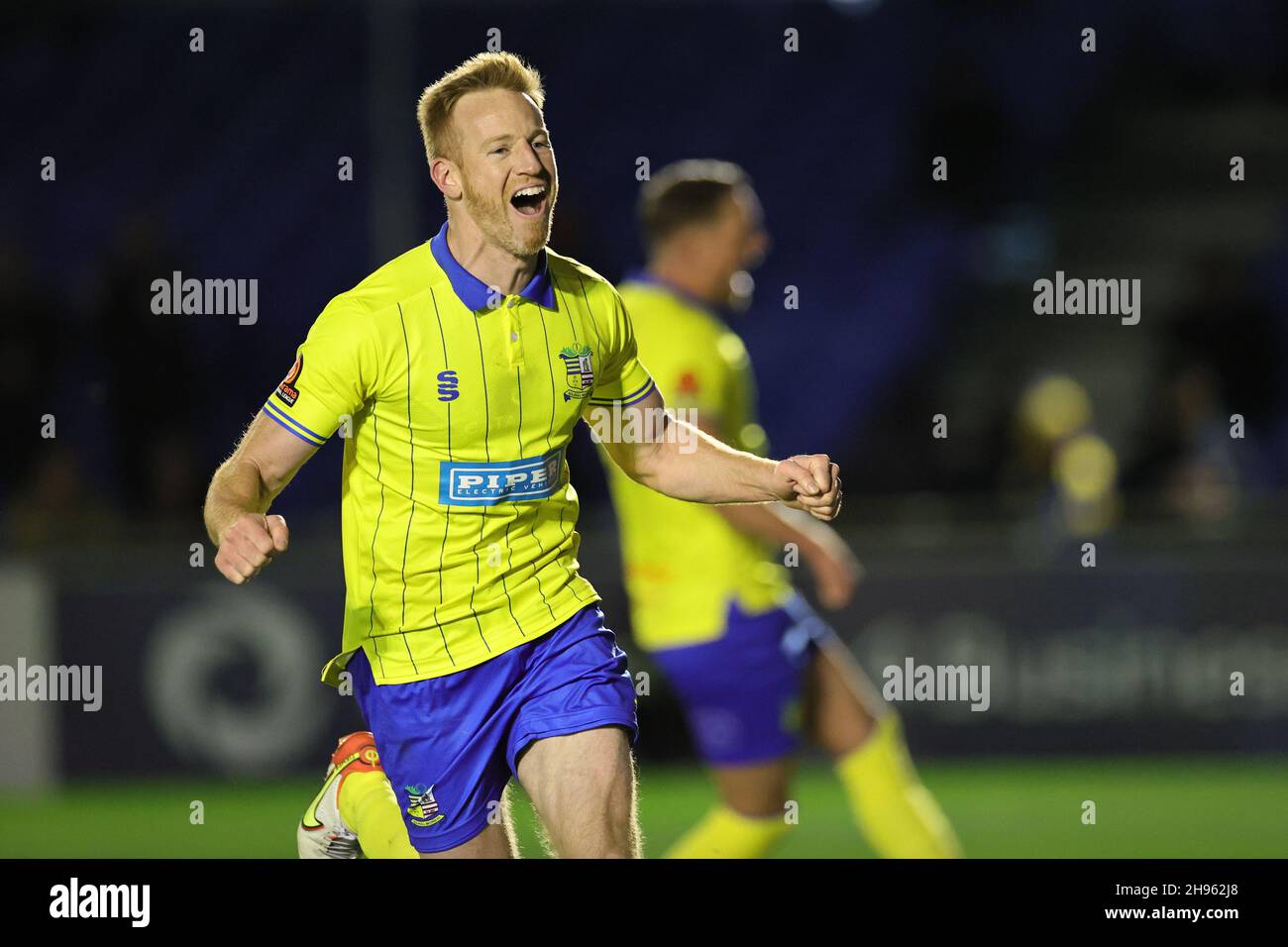 SOLIHULL, ENGLAND. DECEMBER 4TH 2021. Adam Rooney of Solihull Moors celebrates after scoring their teams second goal from the penalty spot during the Vanarama National League match between Solihull Moors and Woking FC at the Armco Stadium, Solihull on Saturday 4th December 2021. (Credit: James Holyoak/Alamy Live News) Stock Photo
