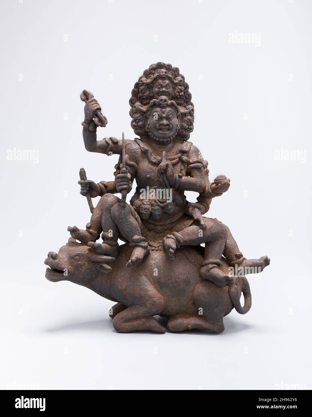 Krishna Yamari, Dali kingdom (937-1253), c. 12th century. Many-headed deity  with six arms and legs, seated on a buffalo. Yunnan province Stock Photo -  Alamy