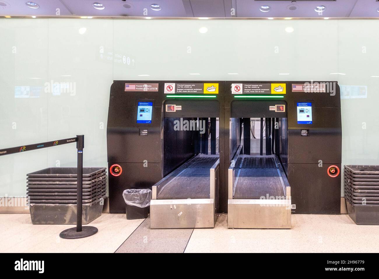 No people at a self luggage dispatch machine at Terminal 3 at Pearson International Airport. Dec. 4, 2021 Stock Photo