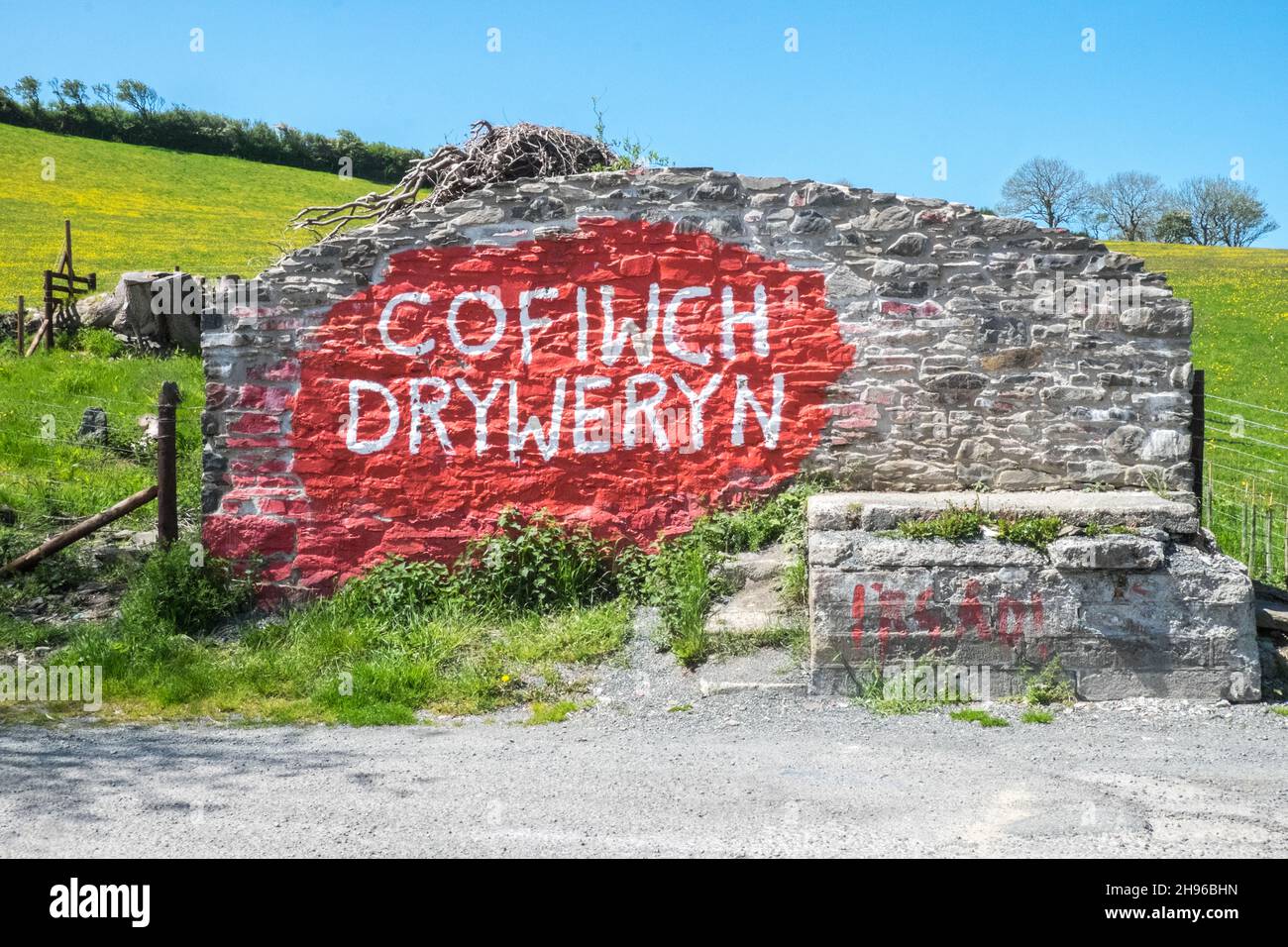 The Cofiwch Dryweryn mural,political,grafitti,on the A487 near Llanrhystud,south,Aberystwyth has been repeatedly vandalised.The protest image was painted in 1965 after the village of Capel Celyn near Bala in Gwynedd was flooded to create a reservoir to supply water to Liverpool.Cofiwch Dryweryn (English: 'Remember Tryweryn') or Y Wal Cofiwch Dryweryn is a graffitied grafitti,graffitti,graffiti,stone, wall, near, Llanrhystud, Ceredigion, Wales. Cofiwch Dryweryn,West,Mid,Wales,Welsh,Independence,Welsh Independence,nation,national,nationalism,nationalist,pride,passion,patriotism,Great Britain, Stock Photo