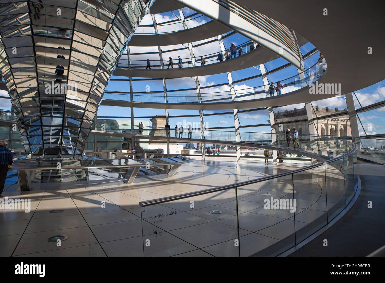 The Reichstag dome on the roof of the German Bundestag in Berlin Mitte from the inside. Modern architecture made of aluminum, glass and mirrors. Stock Photo