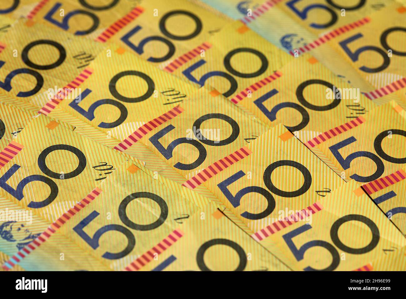 Closeup of many Australian 50 dollar notes. Shallow depth of field Stock Photo