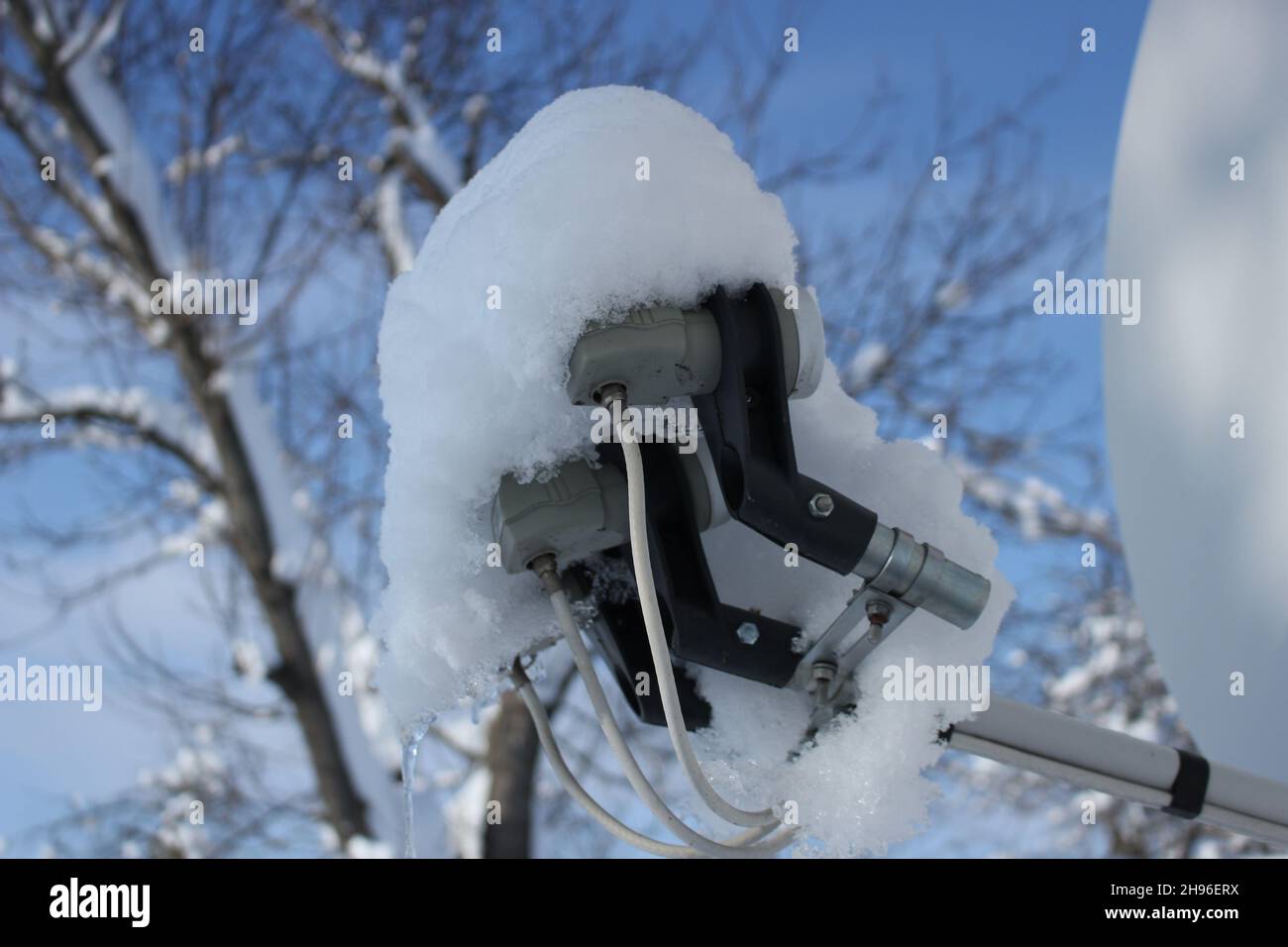 Satellite dish covered with snow Stock Photo Alamy
