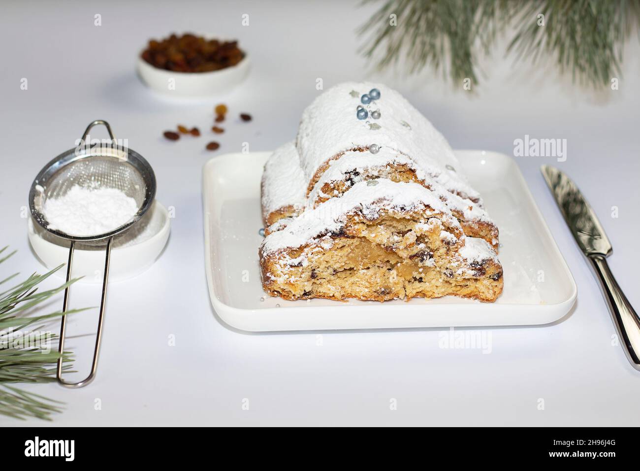 Christmas stollen on wooden white background. Traditional christmas