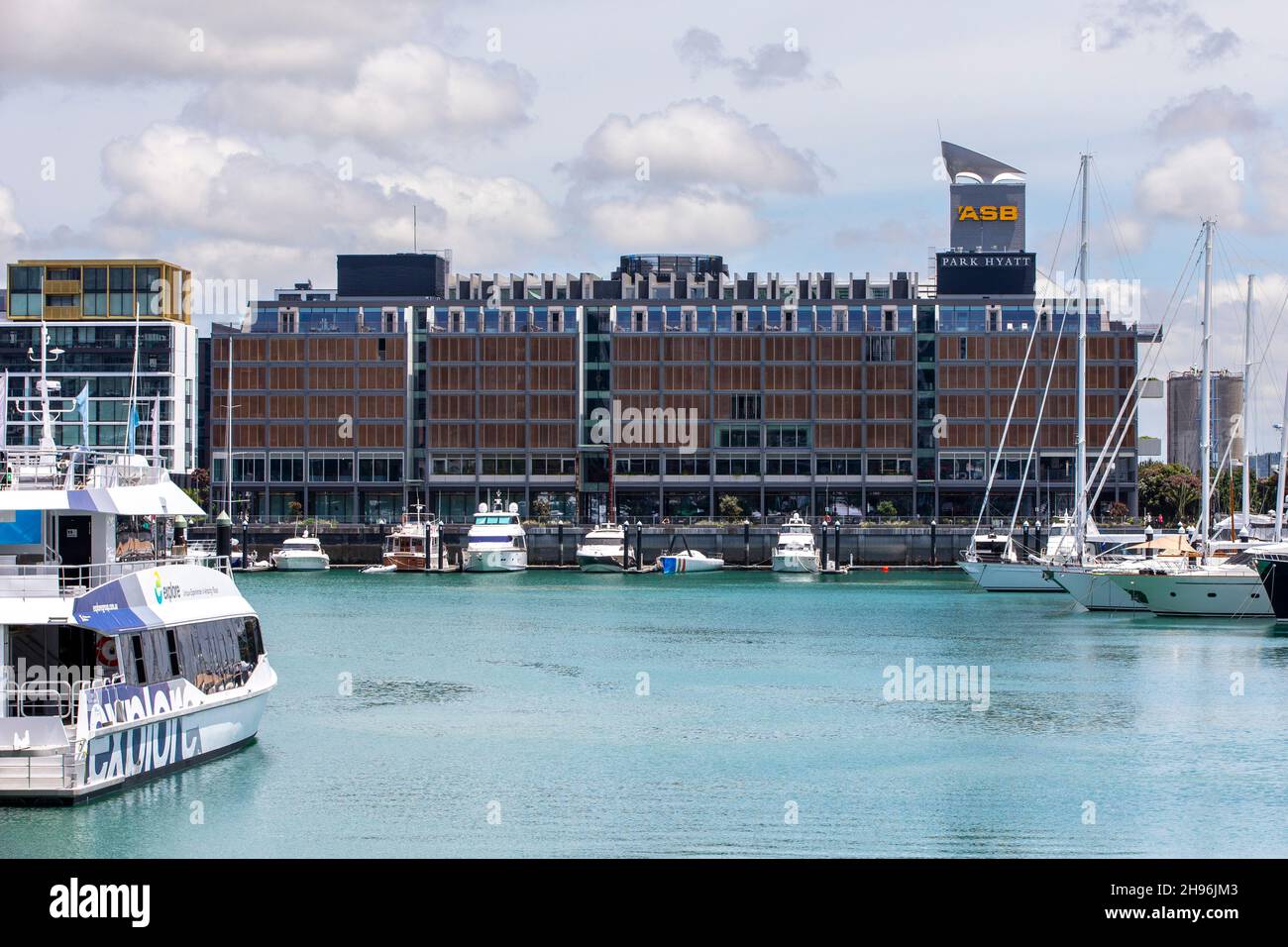 Park Hyatt Hotel and yachts berthed in Viaduct Harbour Auckland New Zealand Stock Photo