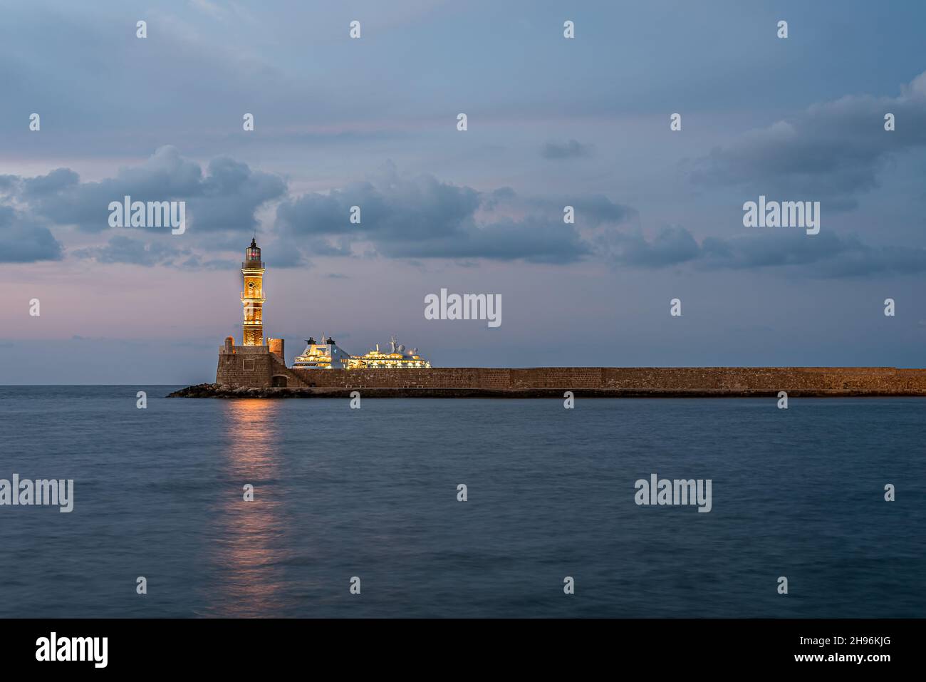 the lighthouse and a cruise ship in the old harbour of Chania, Crete, Greece, October 18, 2021 Stock Photo