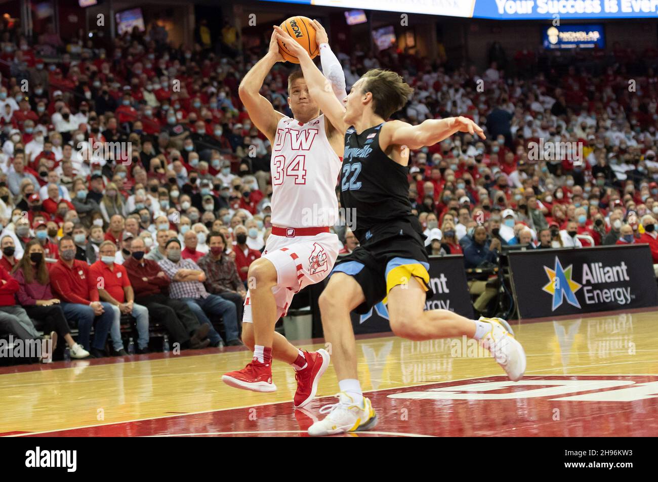 Madison, WI, USA. 4th Dec, 2021. Wisconsin Badgers guard Brad Davison #34 drives to basket against Marquette Golden Eagles guard Tyler Kolek #22 during NCAA basketball game between the Marquette Golden Eagles and the Wisconsin Badgers at Kohl Center in Madison, WI. Wisconsin defeated Marquette 89-76. Kirsten Schmitt/CSM/Alamy Live News Stock Photo