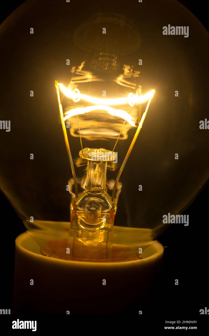 Incandescent bulb on, giving light and warmth Stock Photo Alamy