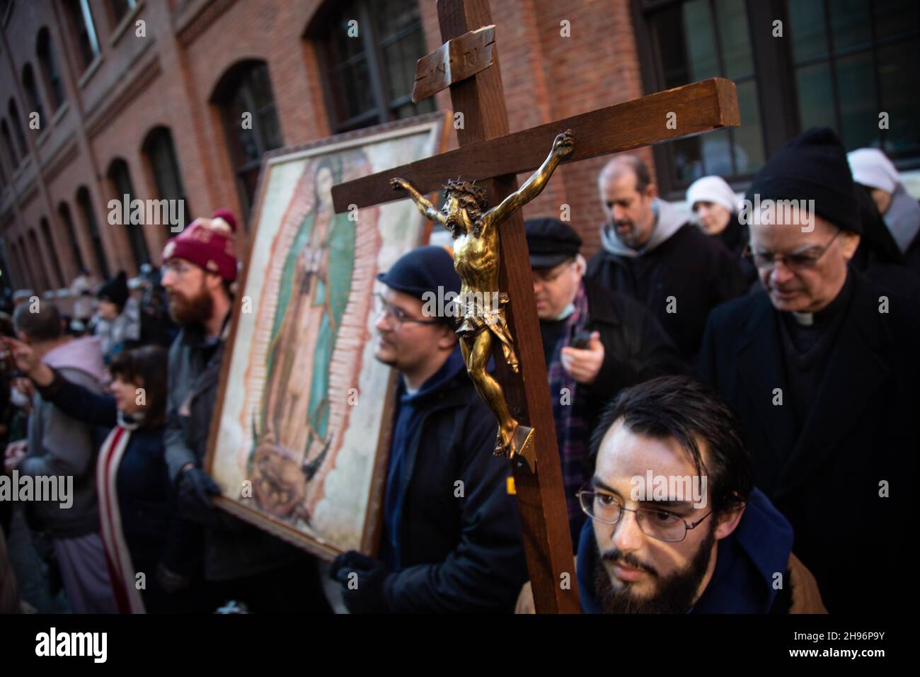 New York, United States. 04th Dec, 2021. A protester holds a cross during the demonstration.Counter-demonstrators ( pro choice) gathered at St. Patrick's Old Cathedral to disrupt a march of the pro-life church group “Witness for Life” on their way to Planned Parenthood. Counter-demonstrators with NYC for Abortion Rights shouted counter slogans to drown out the prayers of pro-lifers, as well as blocking their access to anyone entering Planned Parenthood. Credit: SOPA Images Limited/Alamy Live News Stock Photo