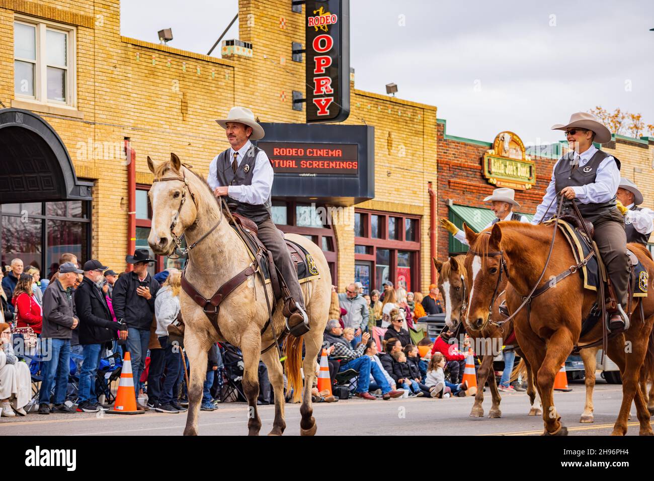 Oklahoma, DEC 4, 2021 Cowboy and cowgirl riding horse in Cowboy