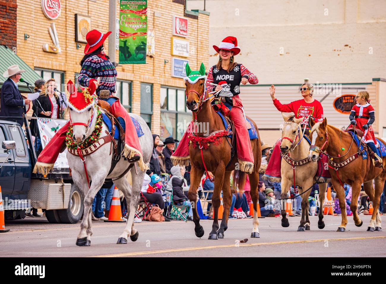 Oklahoma, DEC 4, 2021 Cowboy and cowgirl riding horse in Cowboy