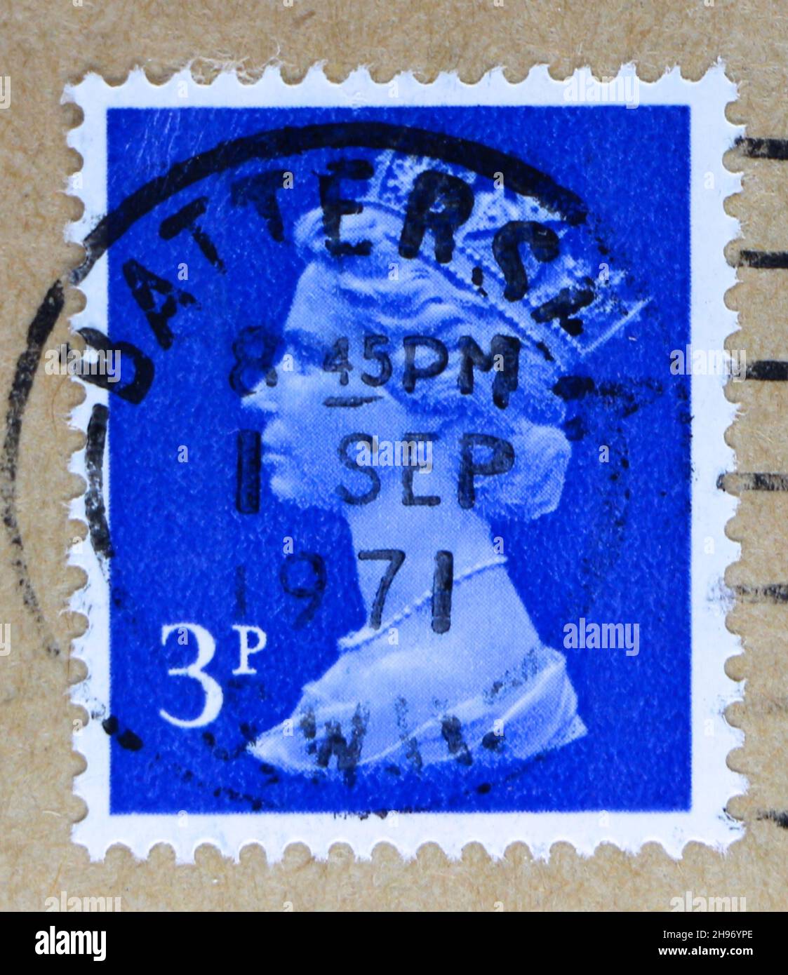 Photo of a blue postage stamp 3p with Queen Elizabeth II in profile Stock Photo