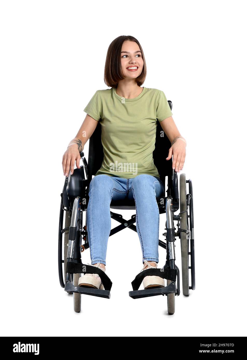 Young woman in wheelchair on white background Stock Photo - Alamy