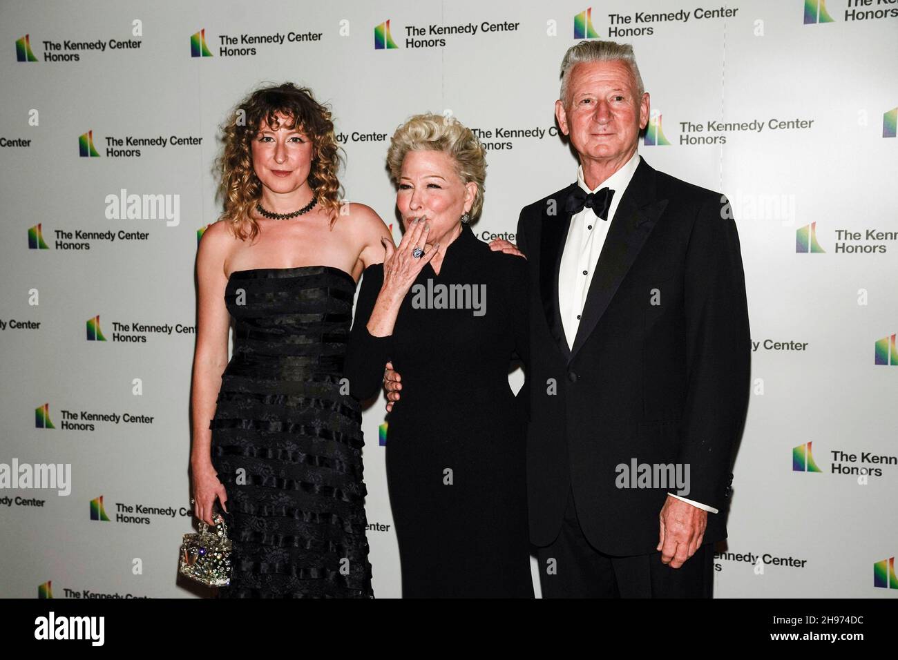 Actress and singer-songwriter Bette Midler, daughter Sofie Haselberg, and  actor Martin von Haselberg pose on the red carpet as they attend the  Kennedy Center Honors medallion ceremony at the Library of Congress