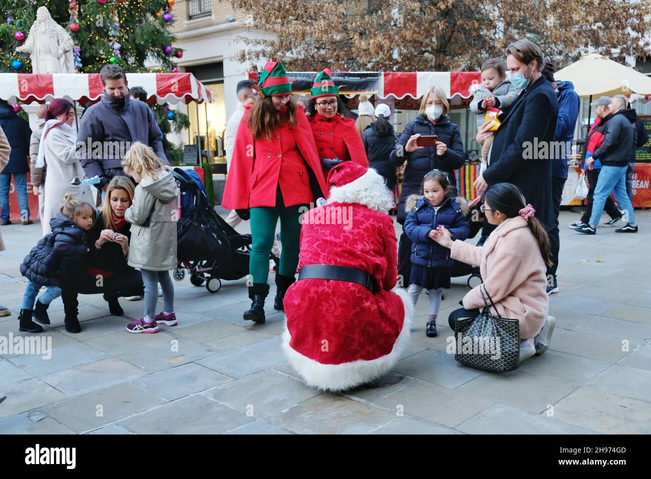 London, UK, 4th Dec, 2021. Families meet Father Christmas and elves at the Chelsea Christmas Shopping event, where visitors also enjoyed a variety of entertainment, free horse and carriage rides and in-store promotions as the countdown to Christmas continues. Credit: Eleventh Hour Photography/Alamy Live News Stock Photo