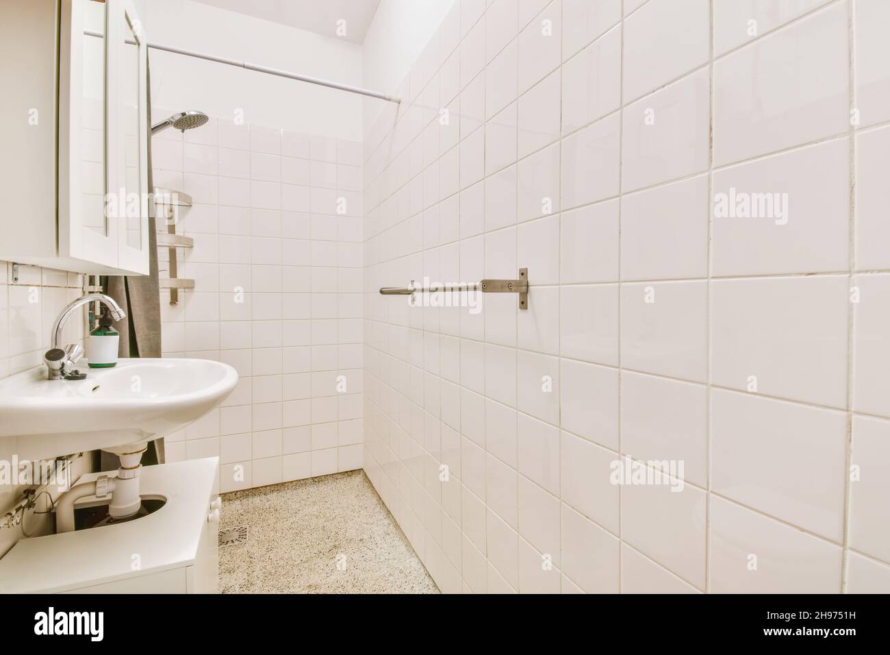 Long narrow bathroom with shower at the beginning Stock Photo Alamy