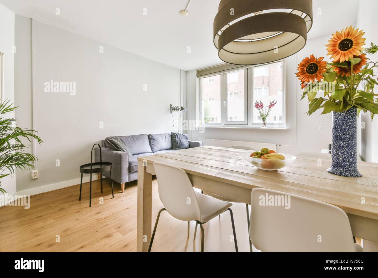 Elegantly combined living room with dining area in a minimalist style ...