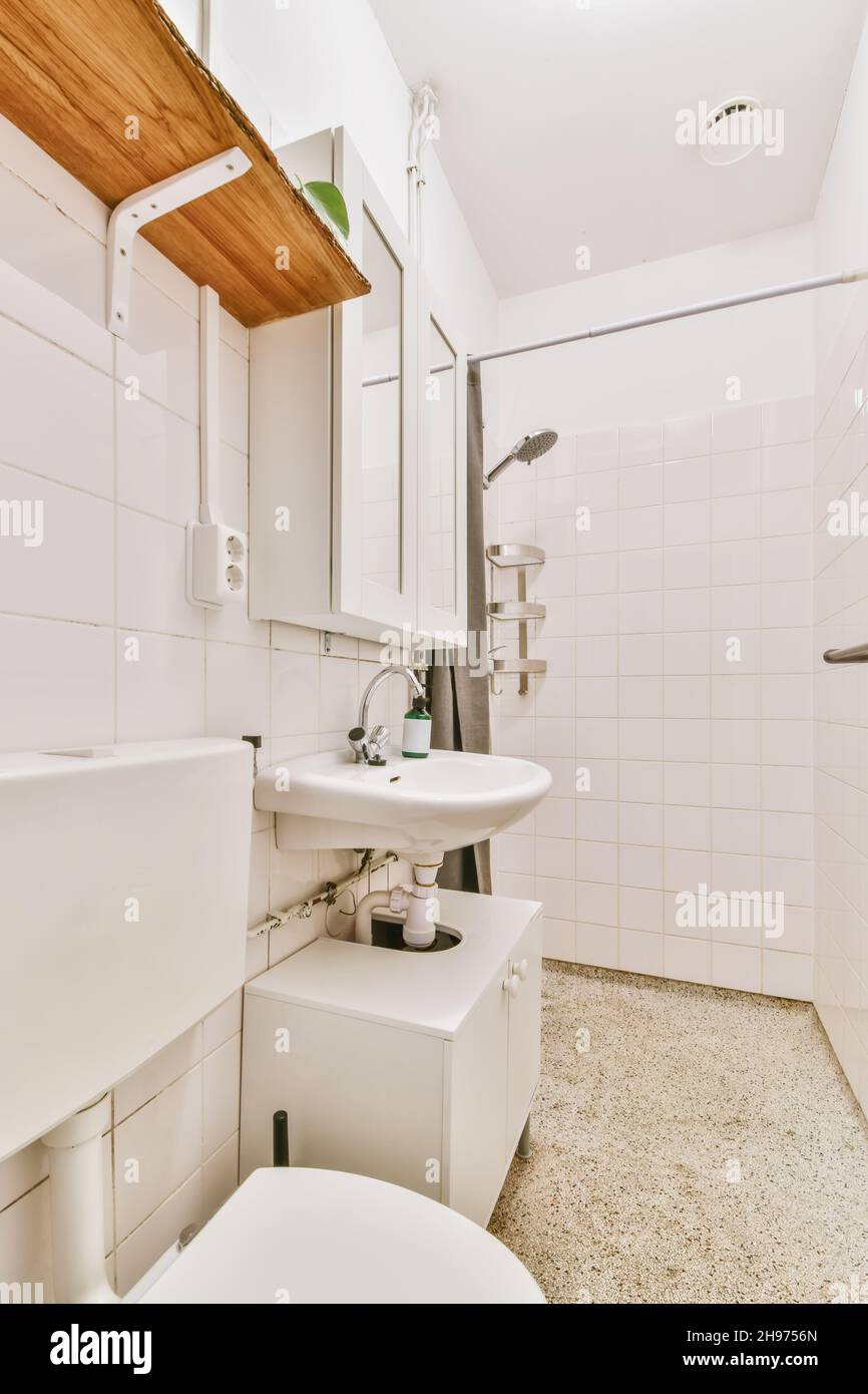 Long narrow bathroom with shower at the beginning Stock Photo Alamy