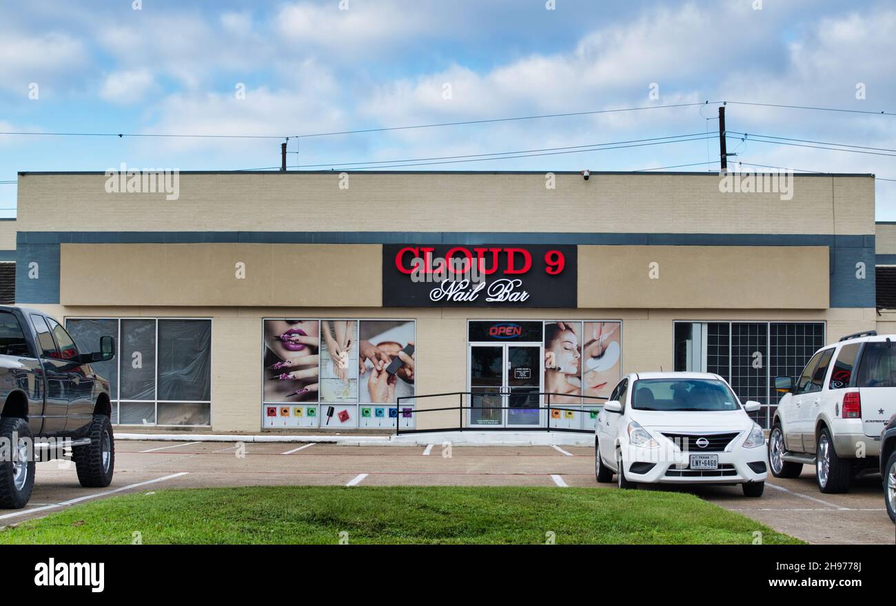 Houston, Texas USA 11-12-2021: Cloud 9 Nail Bar storefront and parking lot in Houston, TX. Luxury spa and salon local business. Stock Photo