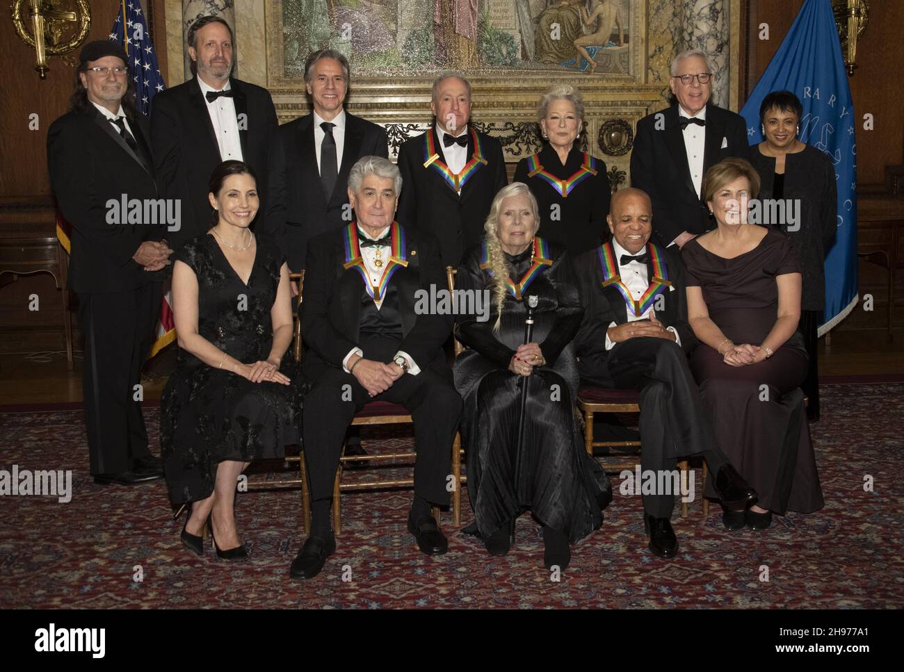 The recipients of the 44th Annual Kennedy Center Honors pose for a group photo following the Medallion Ceremony at the Library of Congress in Washington, DC on Saturday, December 4, 2021. From left to right back row: producer Glenn Weiss, producer Ricky Kirshner, United States Secretary of State Antony Blinken, 'Saturday Night Live' creator Lorne Michaels, legendary stage and screen icon Bette Midler, David M. Rubenstein, chairman of the Kennedy Center for the Performing Arts, and Carla Hayden, the 14th Librarian of Congress. Front row, left to right: Evan Ryan, wife of Secretary Blinken, Stock Photo