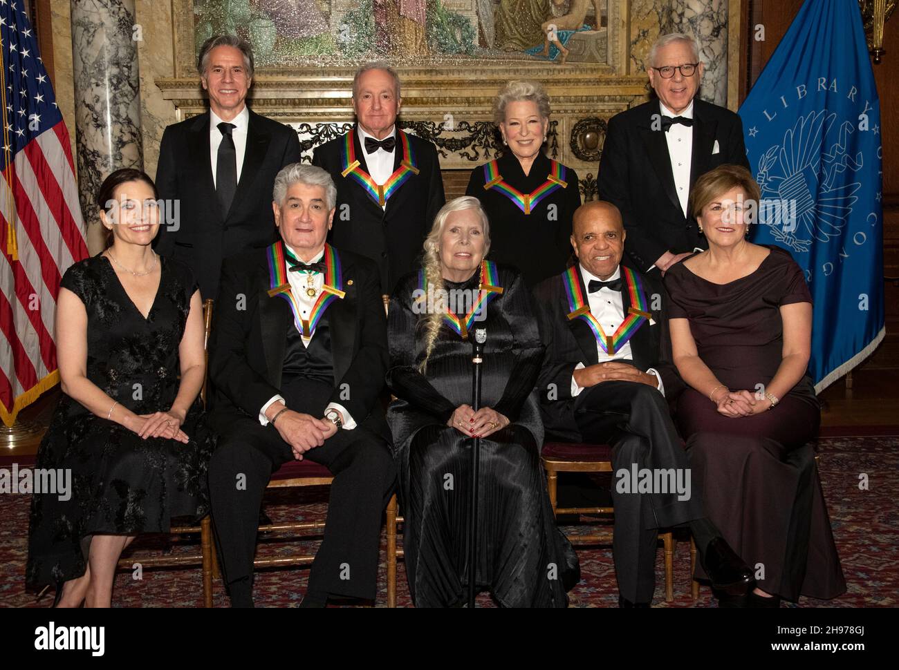 The recipients of the 44th Annual Kennedy Center Honors pose for a group photo following the Medallion Ceremony at the Library of Congress in Washington, DC on Saturday, December 4, 2021. From left to right back row: United States Secretary of State Antony Blinken, Saturday Night Live creator Lorne Michaels, legendary stage and screen icon Bette Midler, and David M. Rubenstein, chairman of the Kennedy Center for the Performing Arts. Front row, left to right: Evan Ryan, wife of Secretary Blinken, operatic bass-baritone Justino Diaz, singer-songwriter Joni Mitchell, Motown founder, songwrite Stock Photo