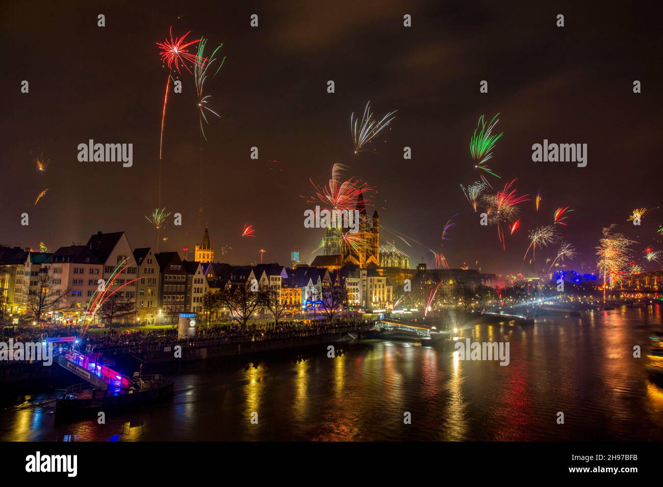 Firework over the Rhine river and Cologne Cathedral, celebration of the New Year in Cologne, Germany. Stock Photo