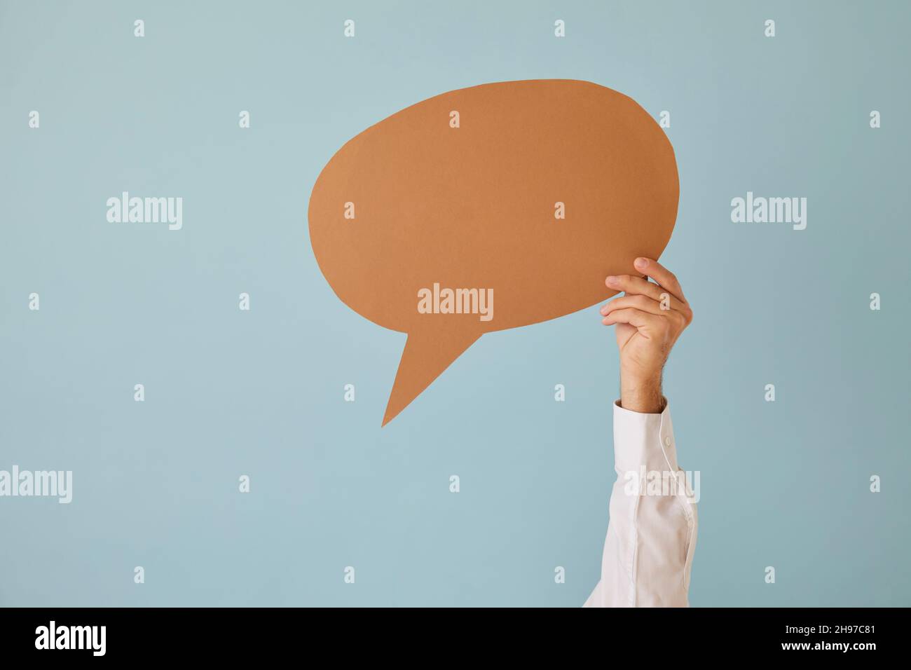 Man hold speech bubble with copy space Stock Photo