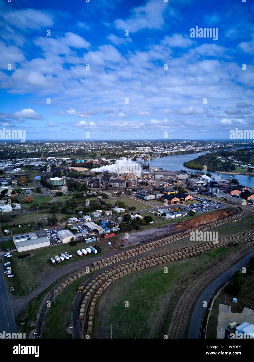Aerial of the sugar cane trains hauling into Millaquin Sugar Mill  and distillery home of Bundaberg Rum Queensland Australia Stock Photo