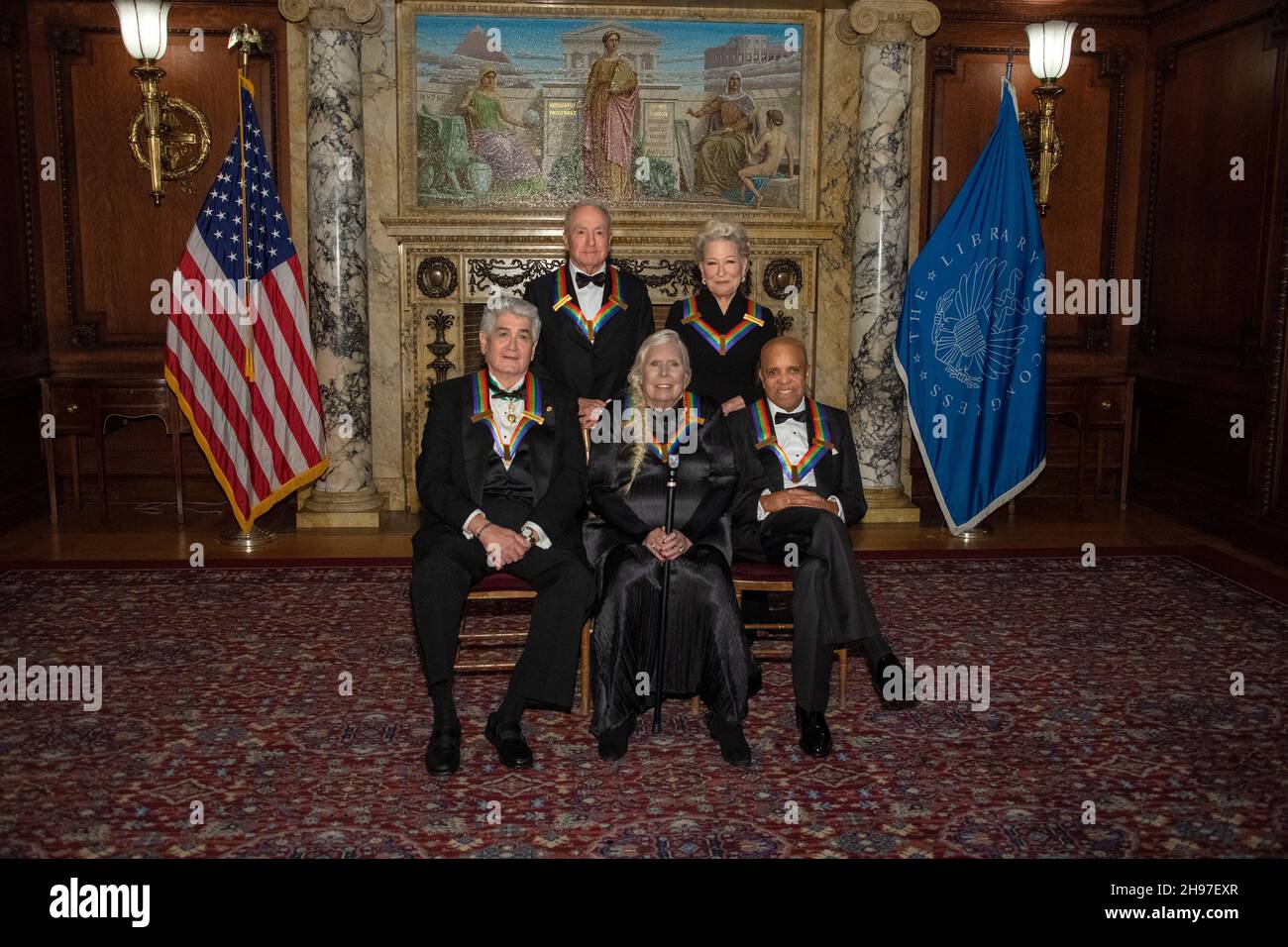 The recipients of the 44th Annual Kennedy Center Honors pose for a group photo following the Medallion Ceremony at the Library of Congress in Washington, D.C. on Saturday, December 4, 2021. From left to right back row: Saturday Night Live creator Lorne Michaels, legendary stage and screen icon Bette Midler. Front row, left to right: operatic bass-baritone Justino Diaz, singer-songwriter Joni Mitchell and Motown founder, songwriter, producer and director Berry Gordy. Credit: Ron Sachs / Pool via CNP Stock Photo