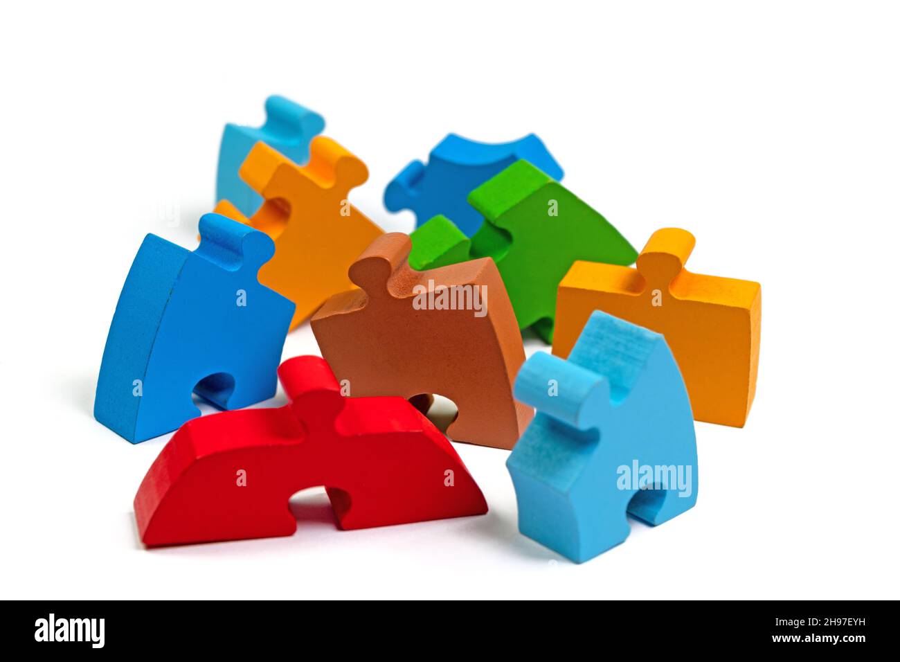 Colorful wooden puzzle pieces against white background Stock Photo - Alamy