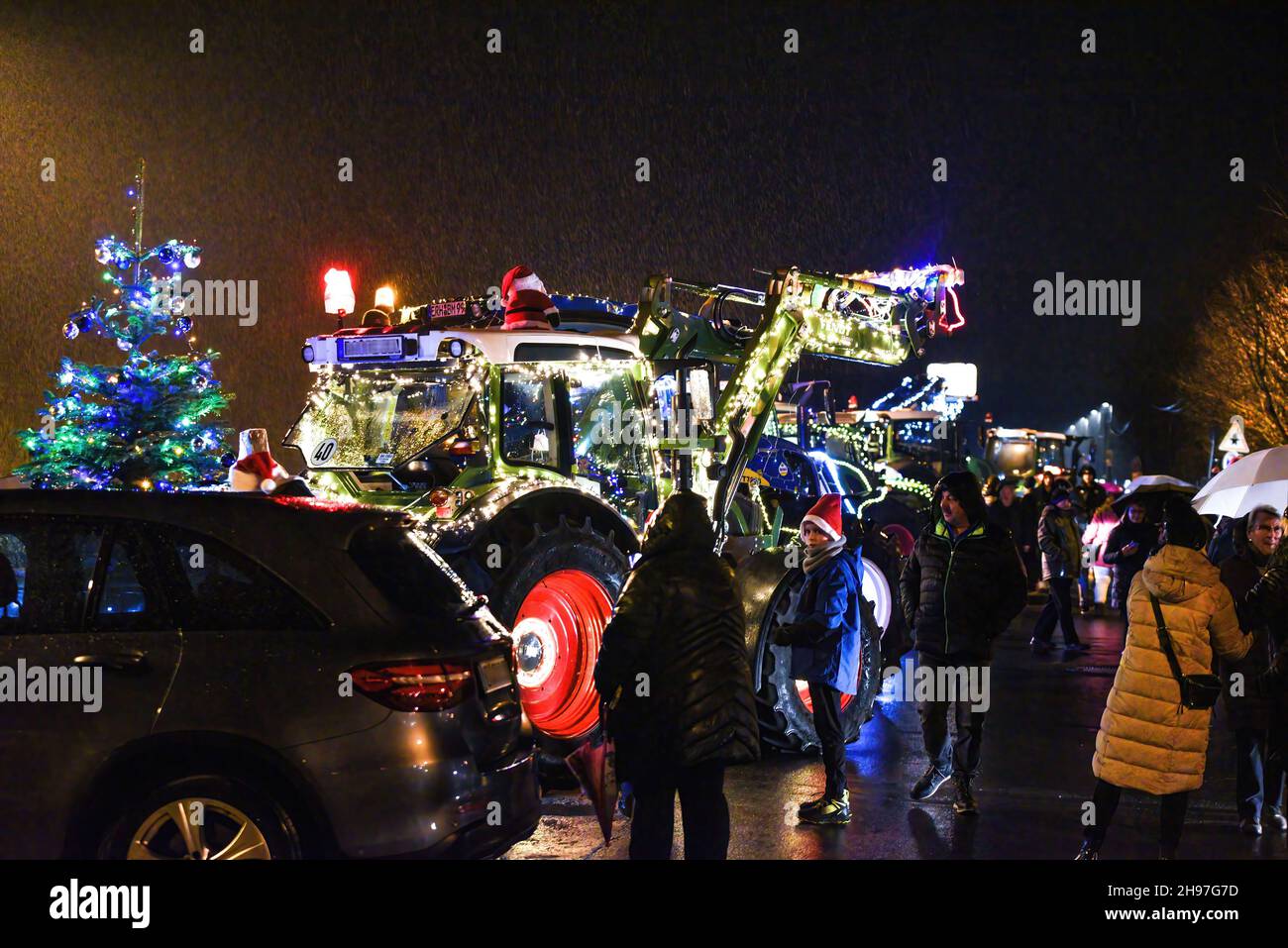 Germany ,Bamberg, Brose Arena - 04 Dec 2021 - Local News - Tractor Christmas display in Bamberg   Image: Farmers from Landkreis Bamberg invited the other farmers from the surrounding regions to participate in a tour through the city of Bamberg, Germany displaying their tractors decorated with Christmas themes. Credit: Ryan Evans/Alamy Live News Stock Photo