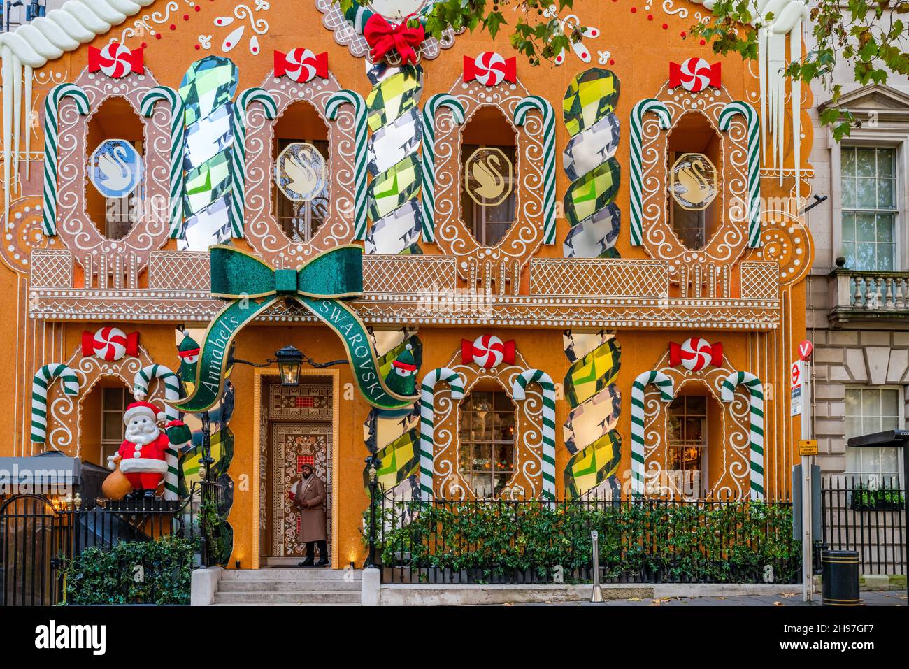 LONDON, UK - DECEMBER 04, 2021: Famous private club Annabel’s in London's Berkeley Square transforms front entrance into a giant gingerbread house Stock Photo