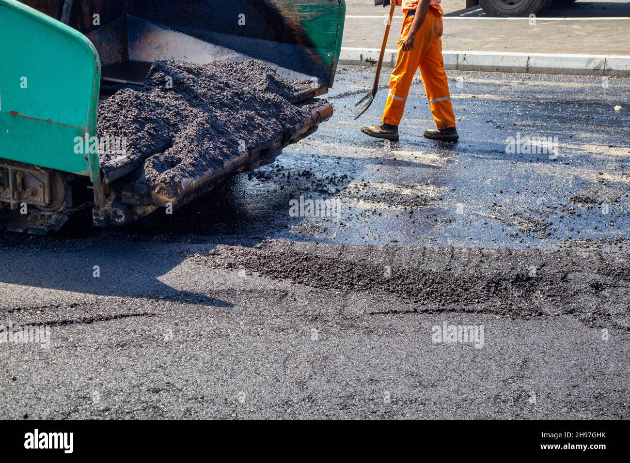 Spread hot asphalt, new asphalt laying work and asphalt paving