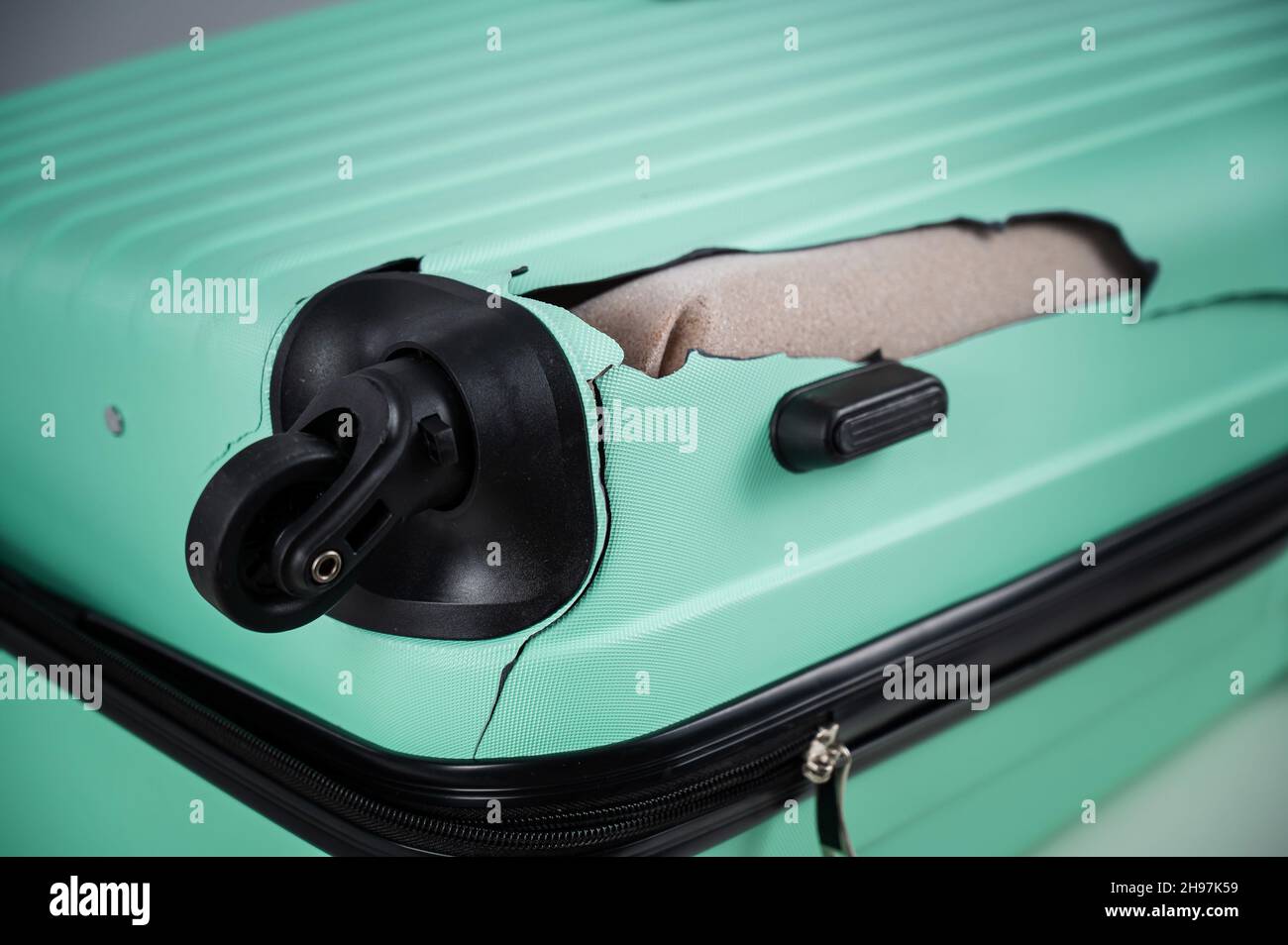 A close-up of a broken plastic suitcase Stock Photo - Alamy