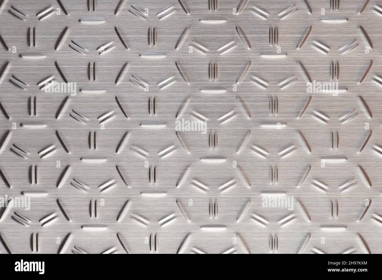 Industrial metal meshed shiny floor background close up Stock Photo