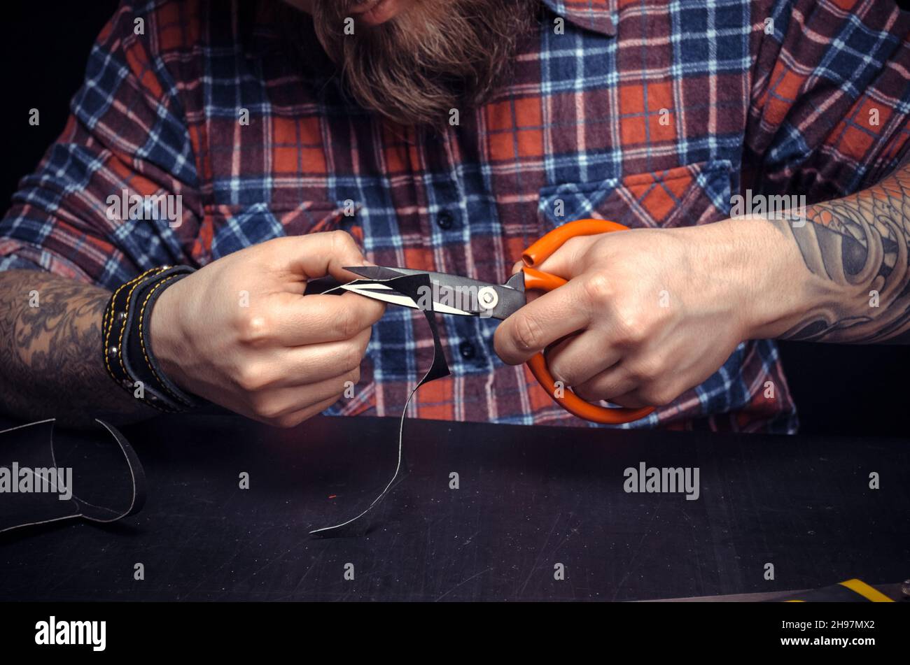 Leather master at work at studio Stock Photo