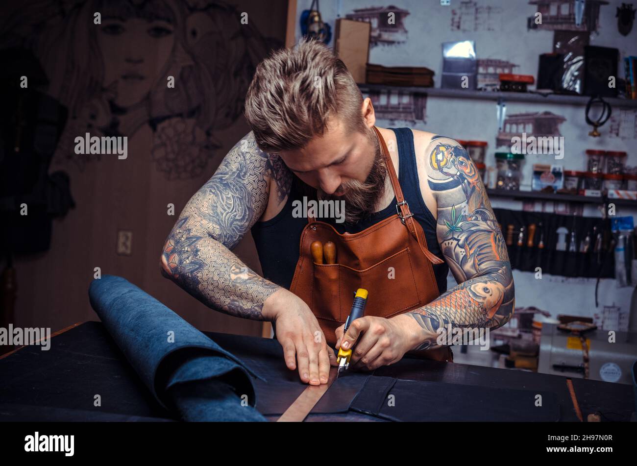 Man working with leather produces leather goods Stock Photo