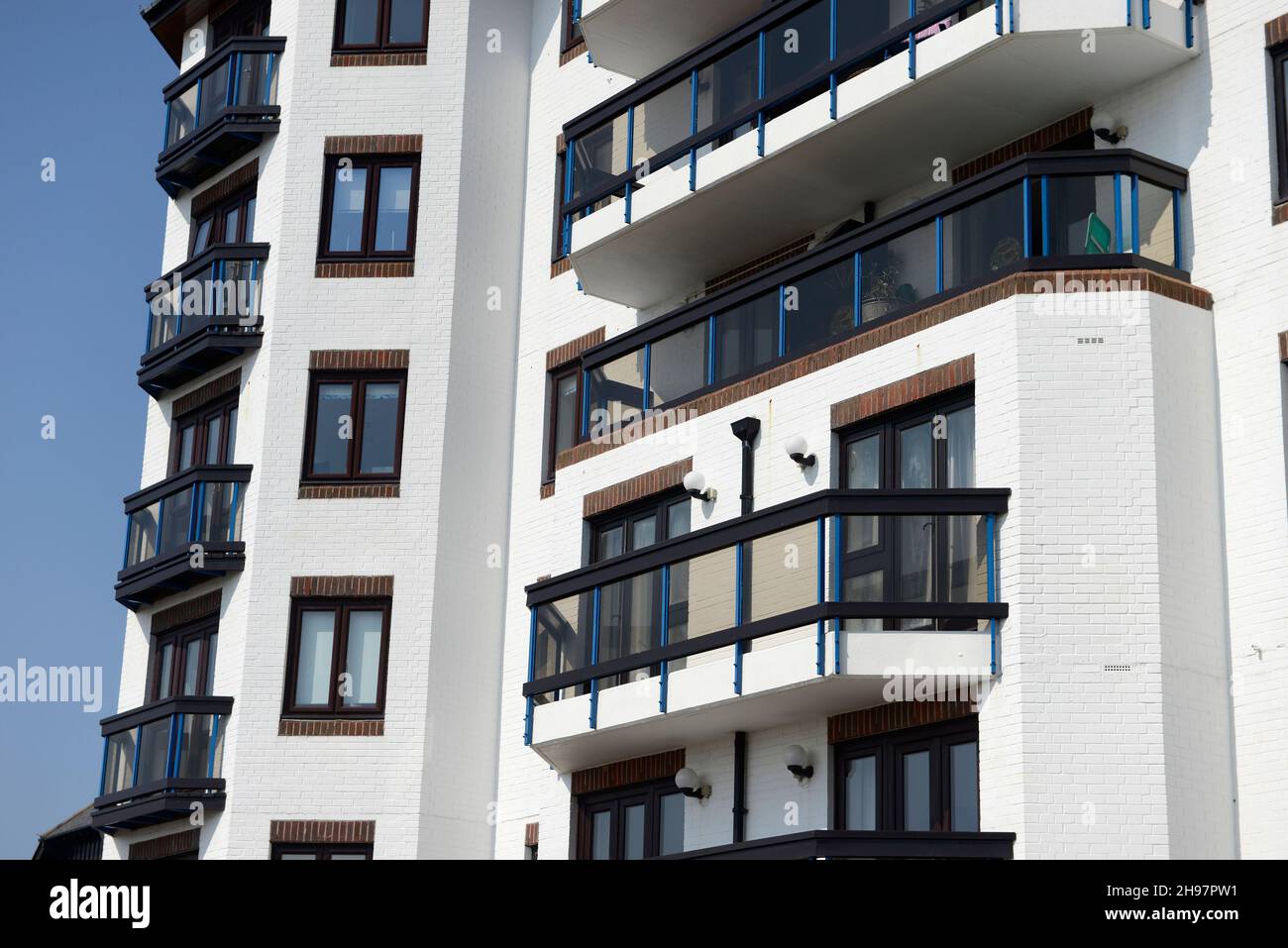 Balconies of a stylish new apartment building by the seafront in