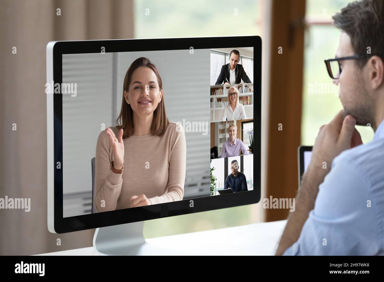 Remote worker watching business webinar, virtual coaching Stock Photo