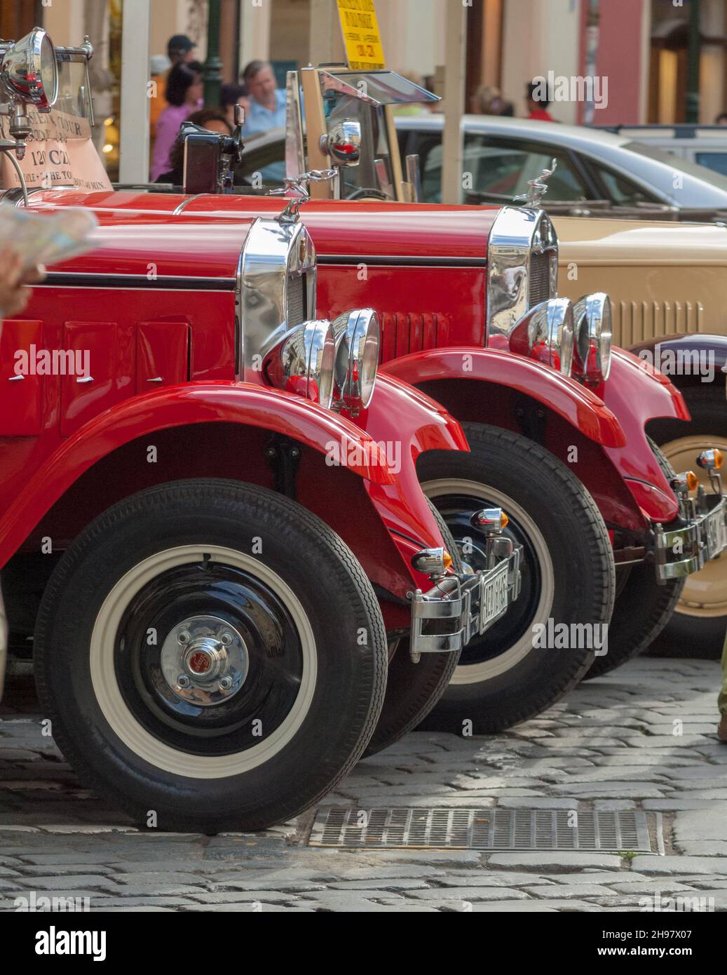 Classic Praga sightseeing tour cars await custom in Prague's Old Town Square, Stock Photo