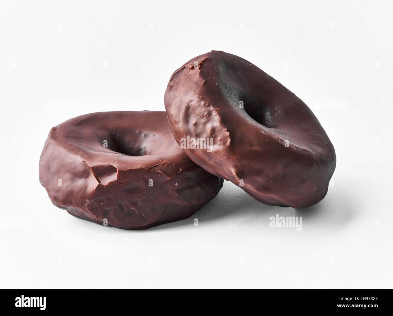 Two delicious chocolate doughnuts isolated on a white background Stock ...