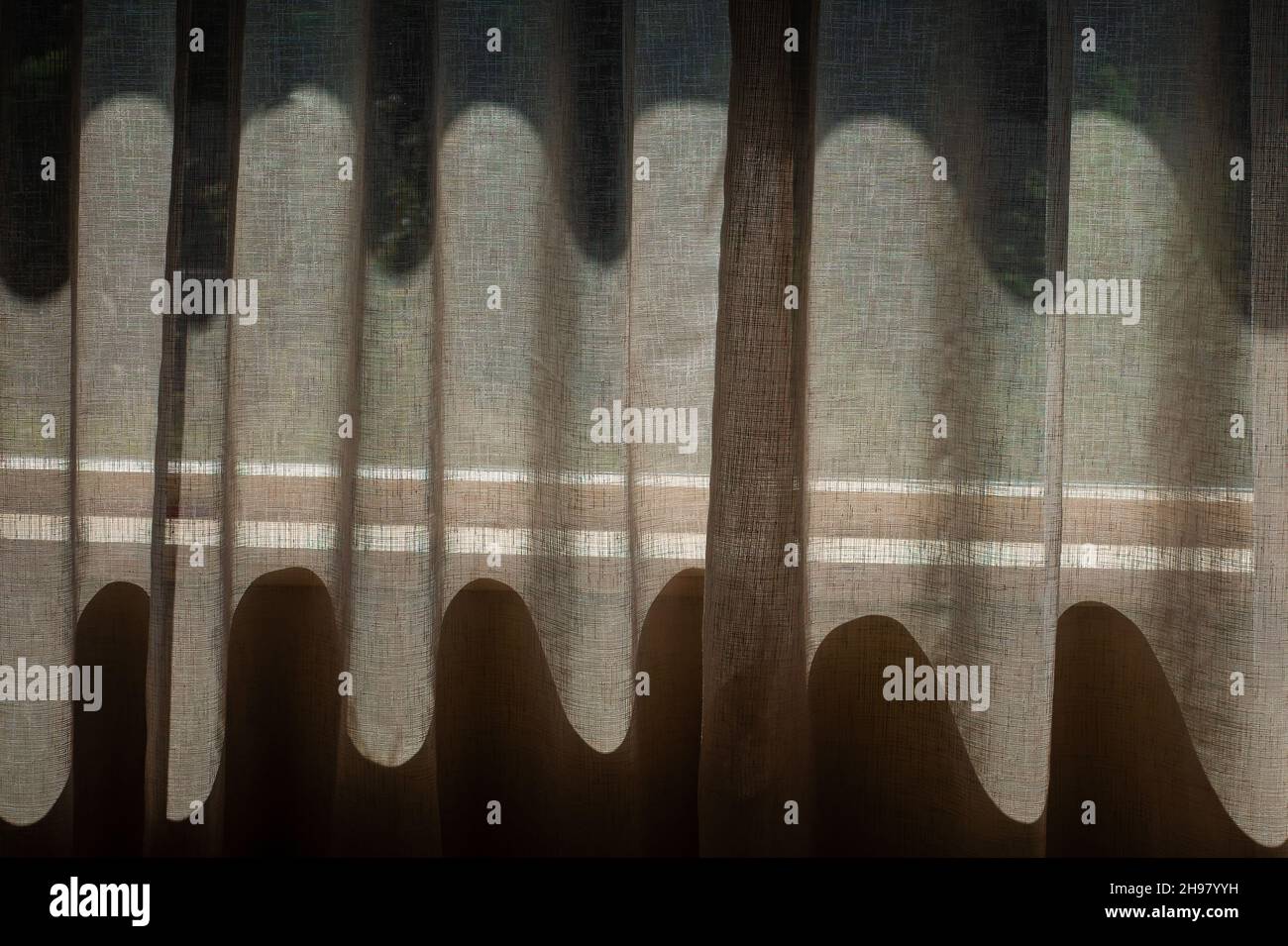 sunlight through net curtains Stock Photo