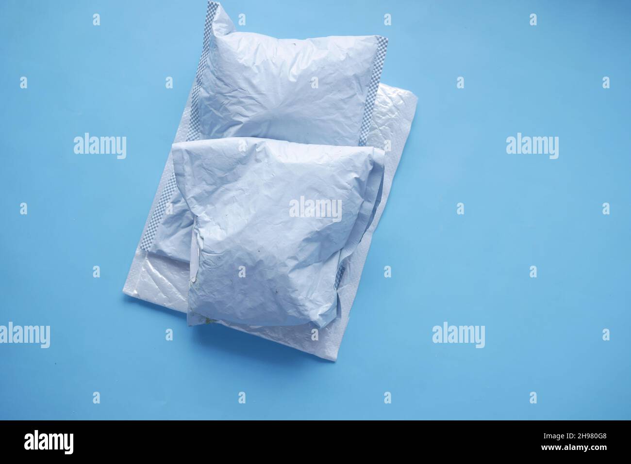 white paper bubble envelope on blue background  Stock Photo
