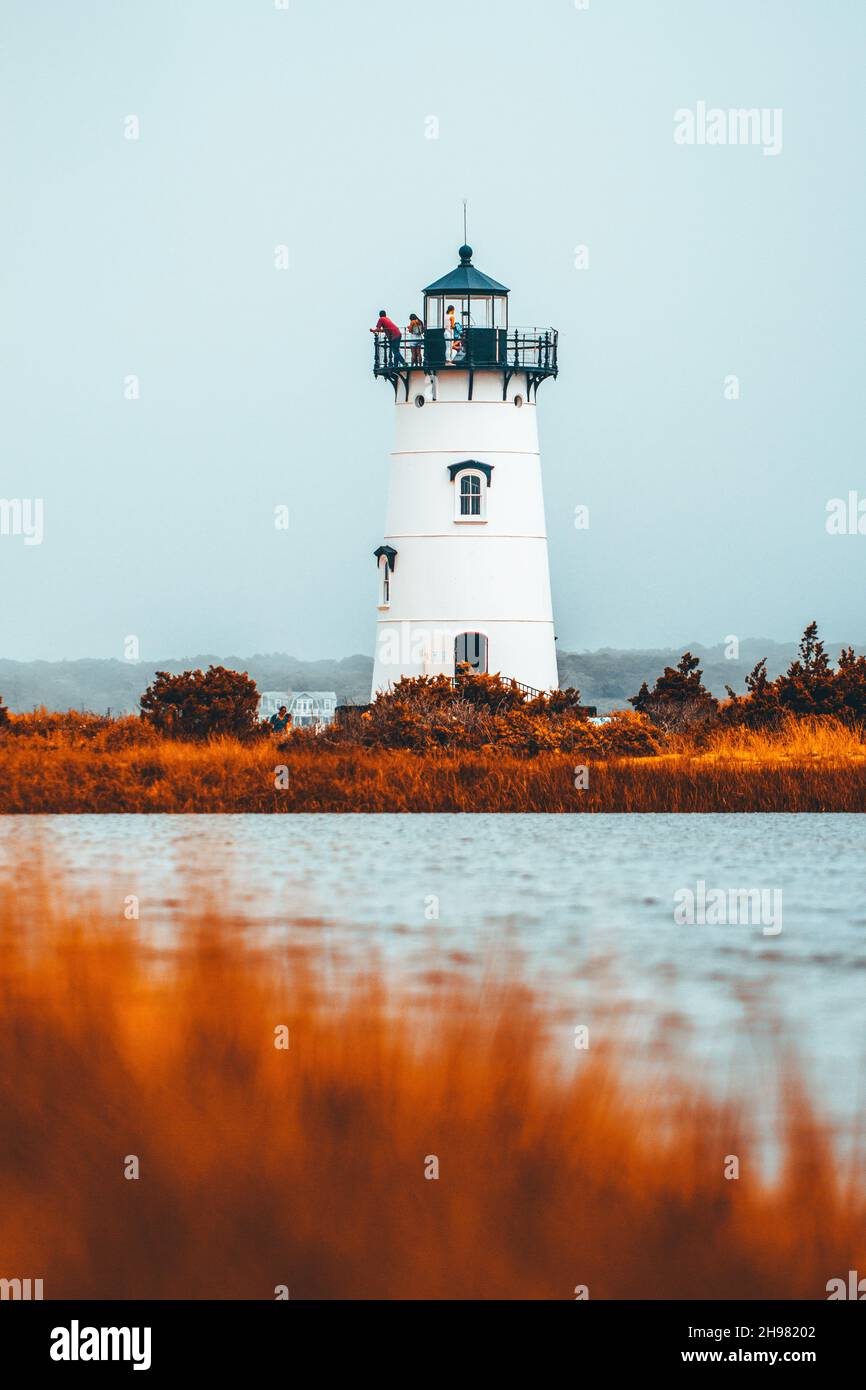 A vertical shot of the Edgartown Harbor Lighthouse during golden autumn ...