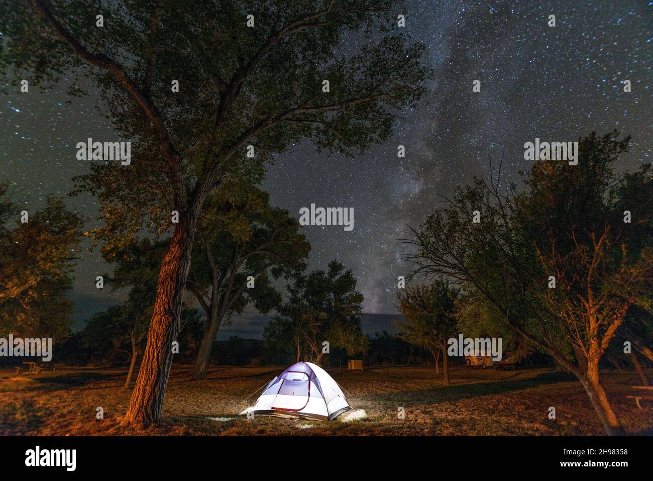 An illuminated tent at night on a campground in Big Bend National Park