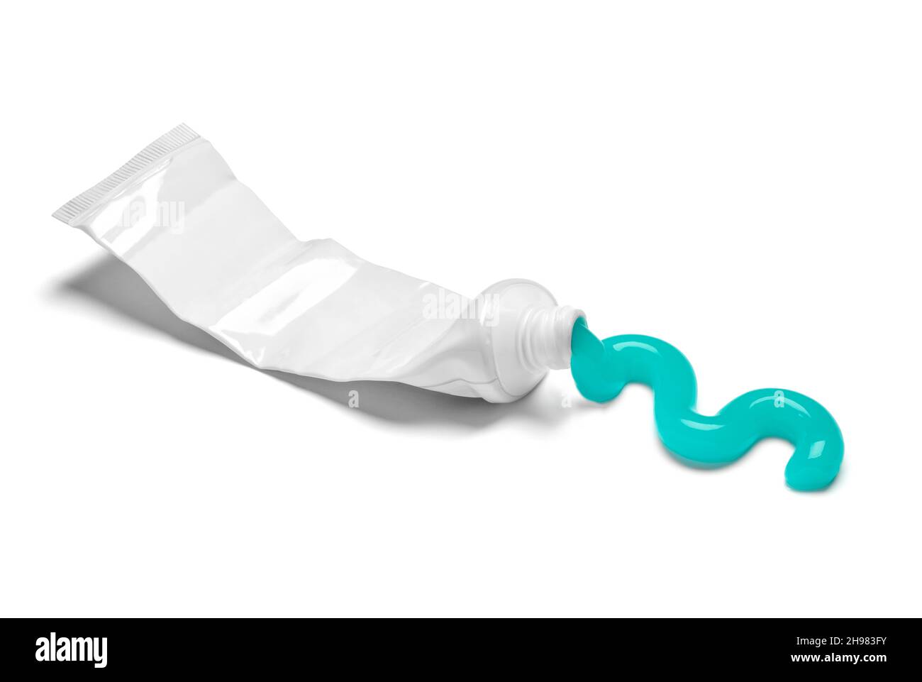 close up of a used empty toothpaste tube on white background Stock