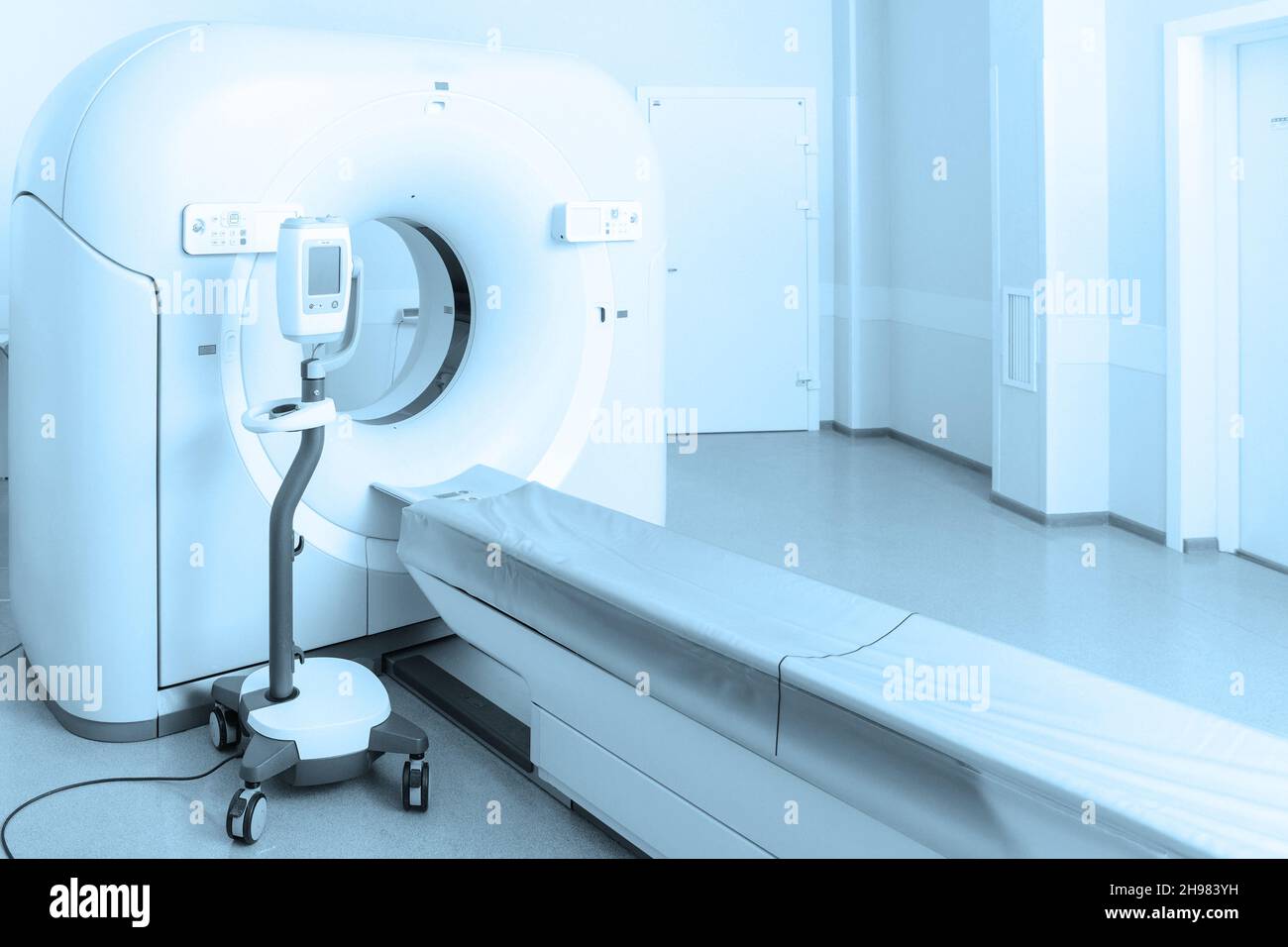Medical CT or MRI Scan in the modern hospital laboratory. Interior of radiography department. Technologically advanced equipment in white room Stock Photo