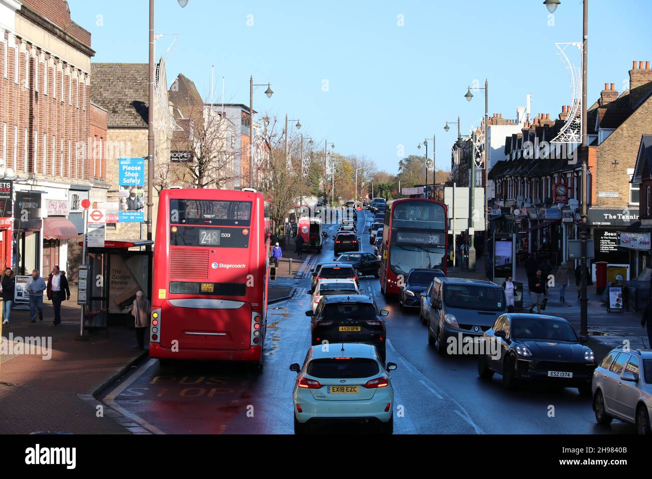 A VIEW OF STATION ROAD IN UPMINSTER,ESSEX WITH TRAFFIC Stock Photo Alamy