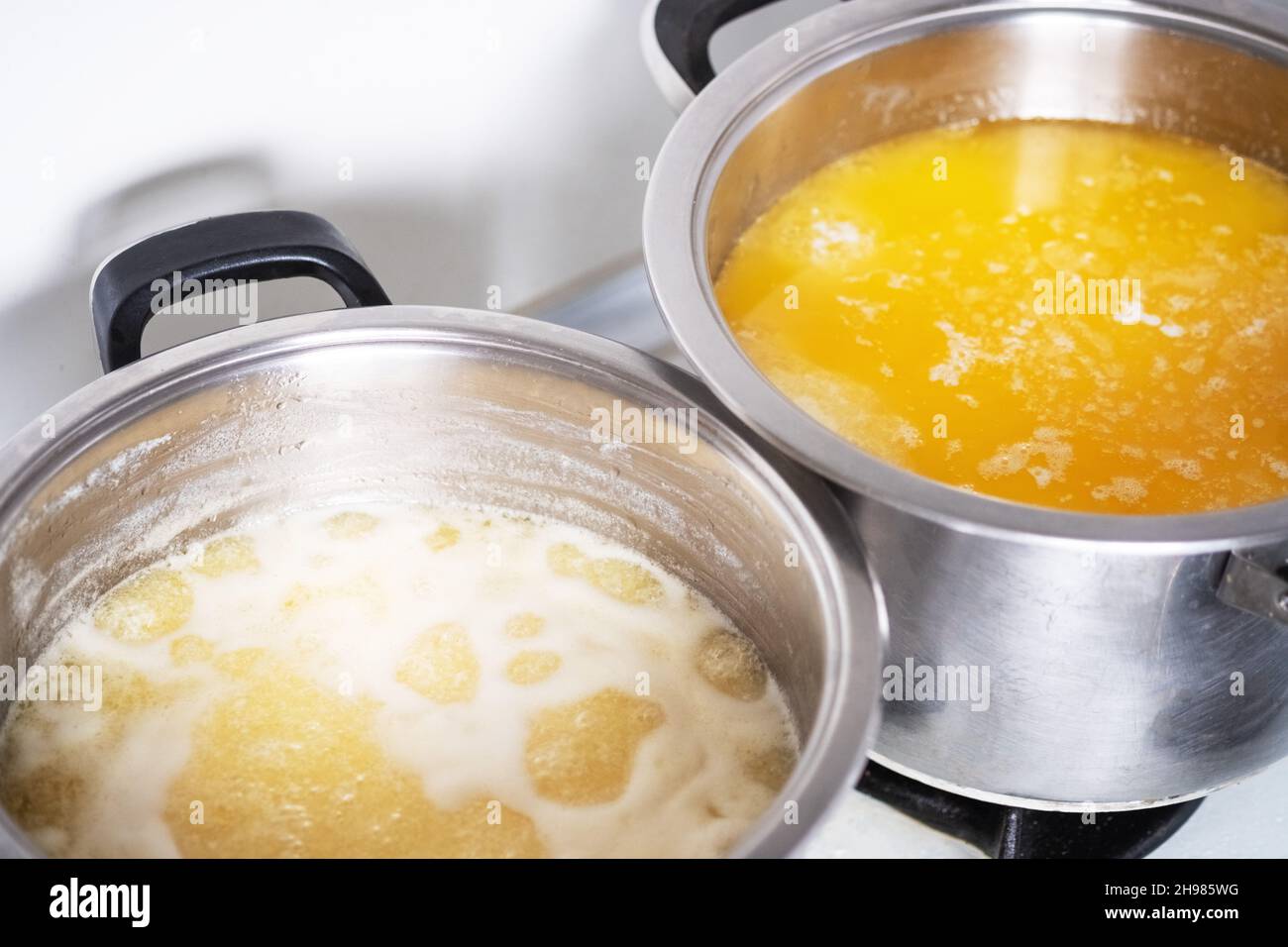 Melt the butter in a stainless saucepan. Cooking ghee. Stock Photo